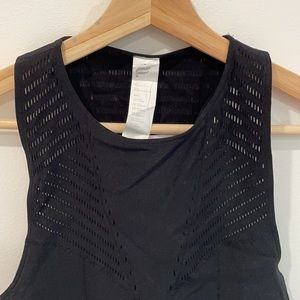 Black fabletics sports bra with mesh detail. Brand new, never used.